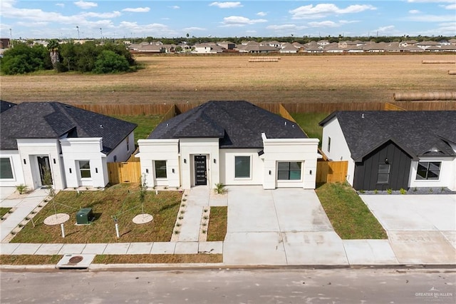 1923 Lime St, San Juan, TX 78589 - view of front of home featuring driveway and stucco siding