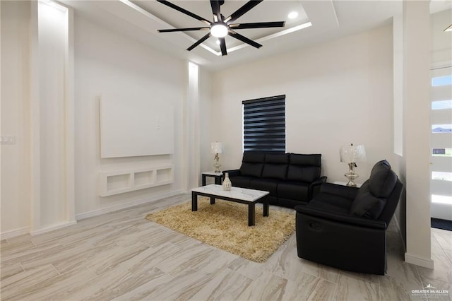 1923 Lime St, San Juan, TX 78589 - living area with a ceiling fan, a raised ceiling, recessed lighting, and baseboards
