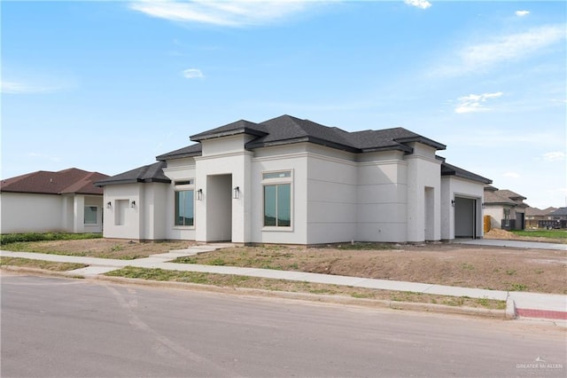 prairie-style home with a garage