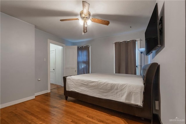 bedroom with hardwood / wood-style flooring and ceiling fan