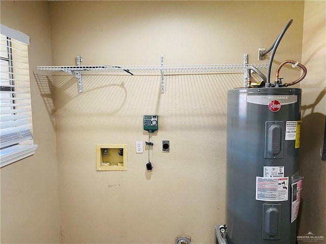 washroom featuring water heater, electric dryer hookup, and hookup for a washing machine