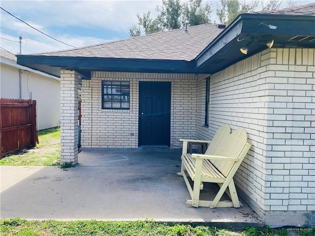 property entrance featuring a patio