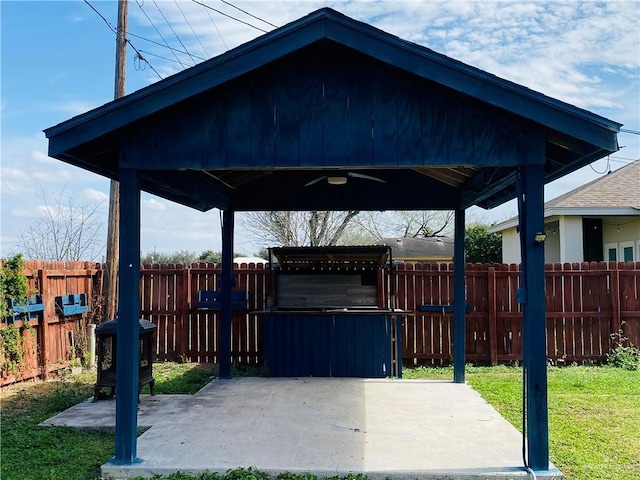 view of patio / terrace featuring ceiling fan and a gazebo