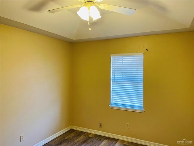 unfurnished room with dark hardwood / wood-style floors and ceiling fan