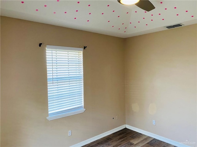 empty room featuring dark hardwood / wood-style floors