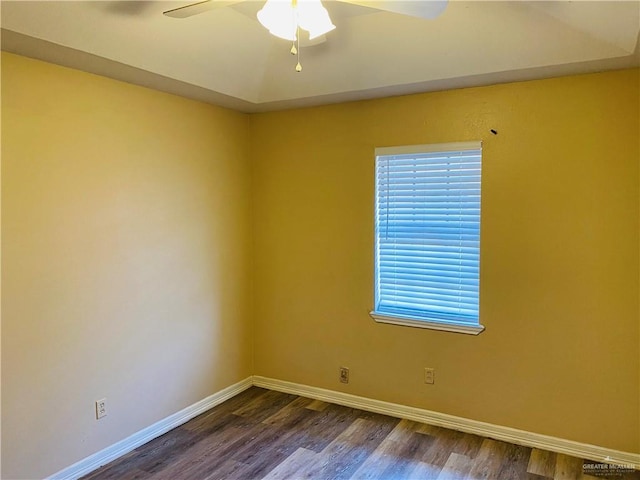 unfurnished room featuring ceiling fan and dark hardwood / wood-style flooring