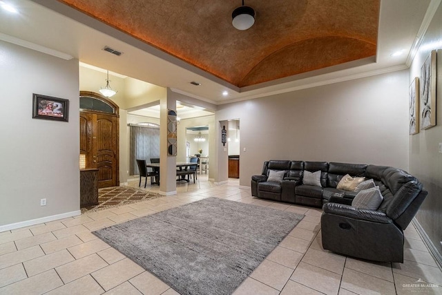 3831 Spicewood Dr, Edinburg, TX 78542 - living room with light tile patterned floors, vaulted ceiling, crown molding, baseboards, and a raised ceiling