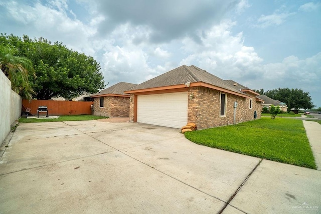 3831 Spicewood Dr, Edinburg, TX 78542 - view of side of property featuring brick siding, a garage, and concrete driveway