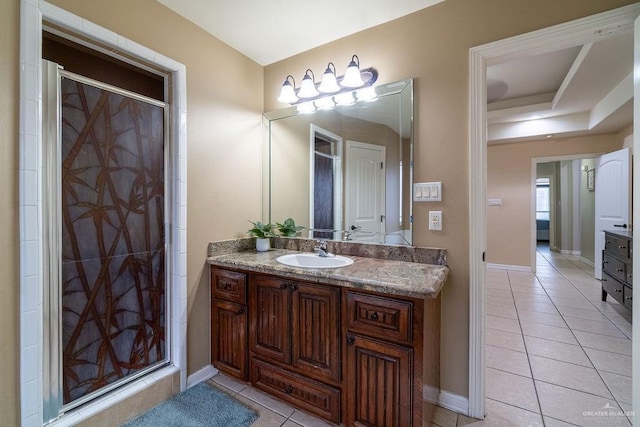 3831 Spicewood Dr, Edinburg, TX 78542 - bathroom with tile patterned floors, vanity, a shower stall, and baseboards