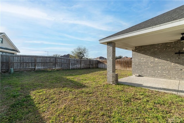 view of yard featuring a patio area and a fenced backyard