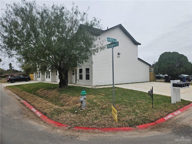 view of home's exterior with a yard