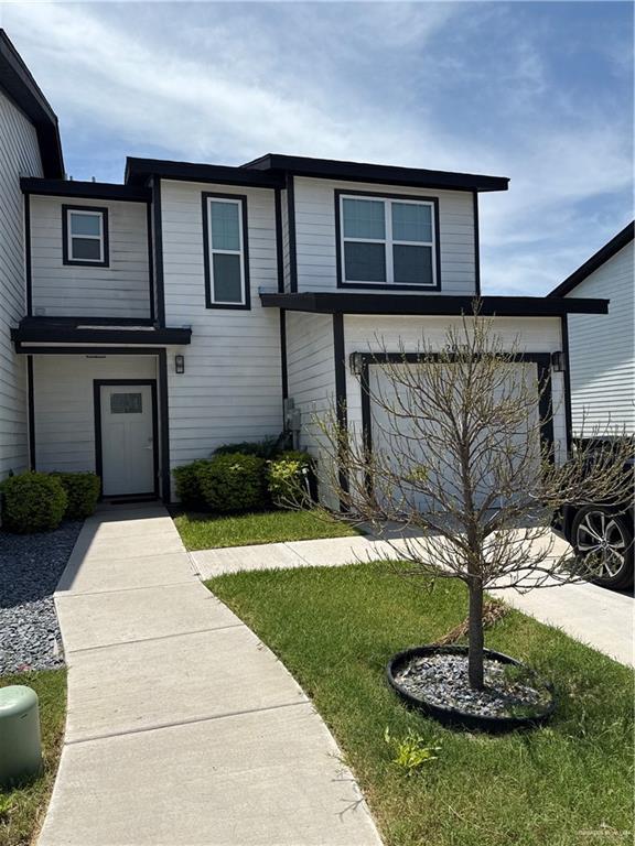 view of front of home with a front lawn