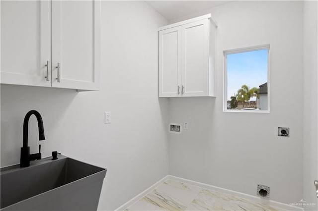 washroom featuring electric dryer hookup, cabinets, sink, and hookup for a washing machine