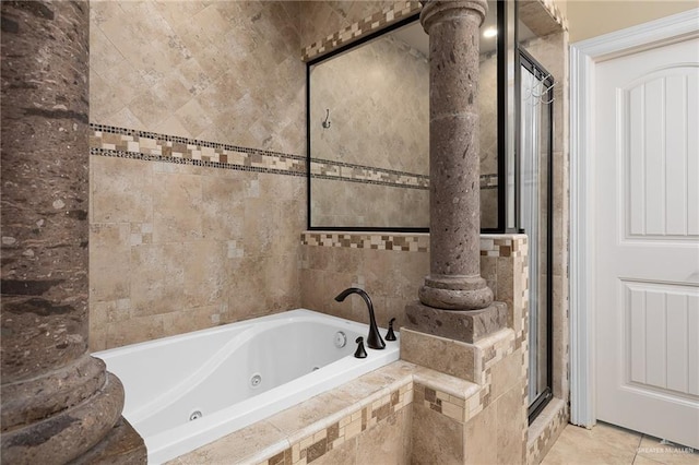 bathroom with tile patterned floors, plus walk in shower, and ornate columns