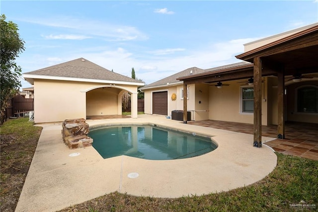 view of swimming pool featuring a patio and ceiling fan