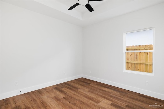 unfurnished room with ceiling fan and wood-type flooring