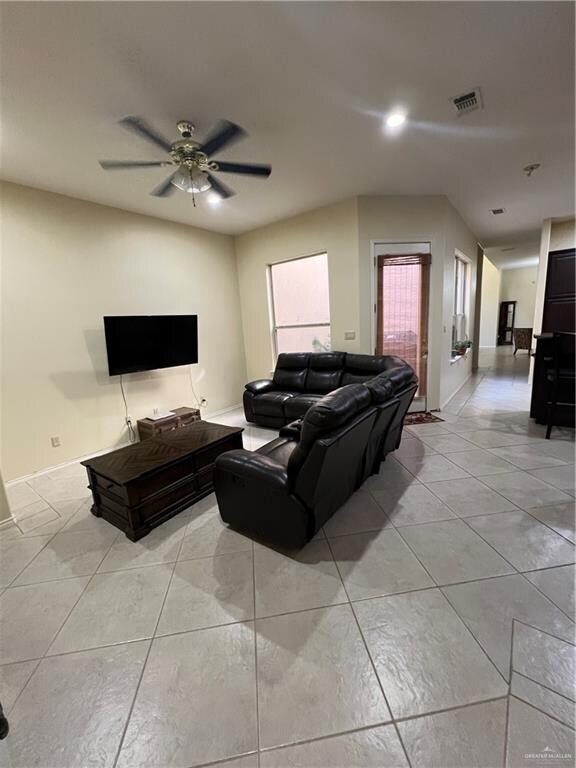 living room featuring ceiling fan