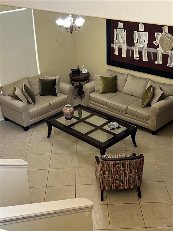 tiled living room featuring a notable chandelier