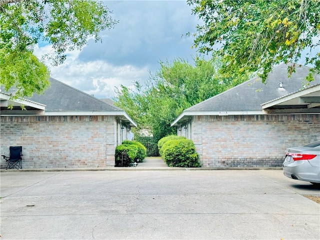 view of side of property with brick siding