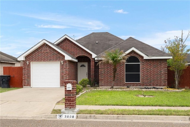 3608 Kingsborough Ave, Mcallen, TX 78504 - ranch-style home featuring an attached garage, brick siding, driveway, and a shingled roof