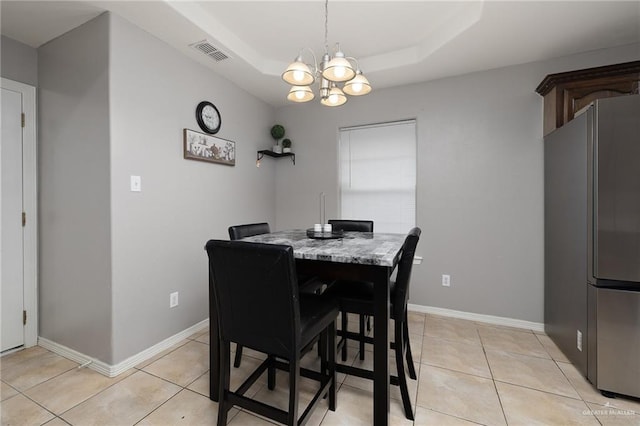 3608 Kingsborough Ave, Mcallen, TX 78504 - dining space with a tray ceiling, a chandelier, light tile patterned floors, and baseboards