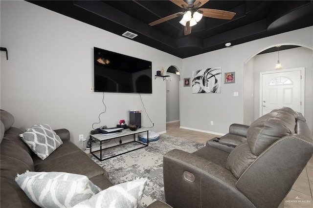 3608 Kingsborough Ave, Mcallen, TX 78504 - living area with tile patterned flooring, arched walkways, a raised ceiling, and ceiling fan