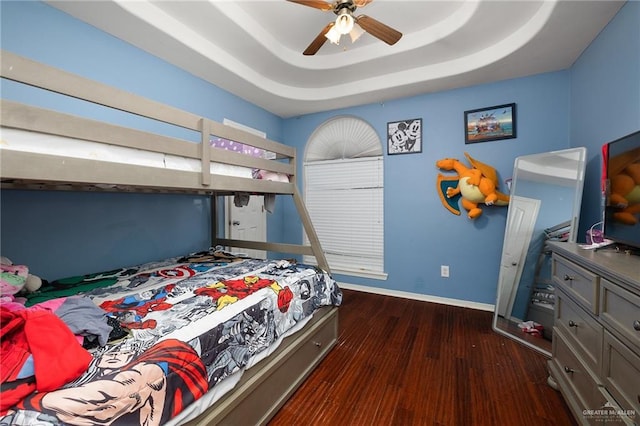 3608 Kingsborough Ave, Mcallen, TX 78504 - bedroom with dark wood-style flooring, baseboards, and a raised ceiling