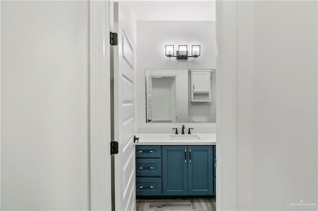 bathroom featuring vanity and wood-type flooring