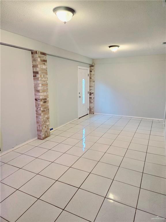 interior space with a textured ceiling