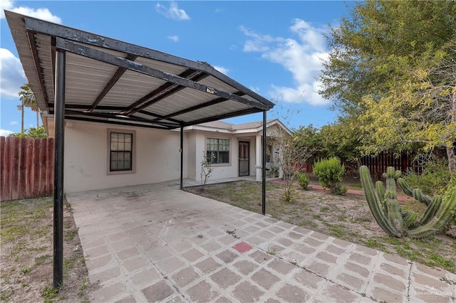 view of patio / terrace featuring a carport