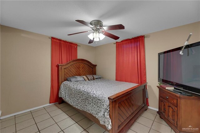 tiled bedroom featuring ceiling fan