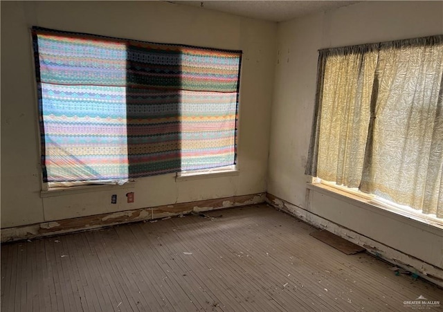 1005 S Nebraska Ave, Weslaco, TX 78596 - unfurnished room with hardwood / wood-style floors