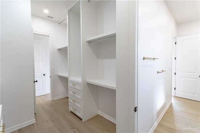 spacious closet with visible vents and light wood-type flooring