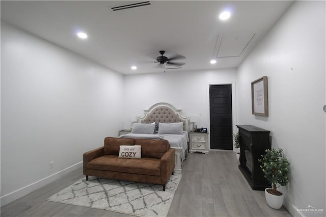 bedroom with light hardwood / wood-style flooring and ceiling fan