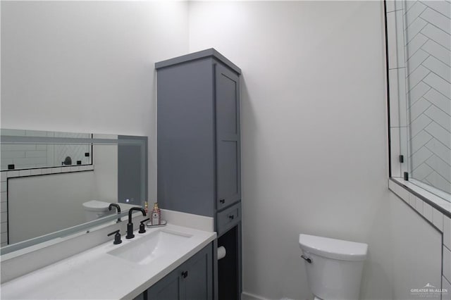 bathroom with vanity and toilet