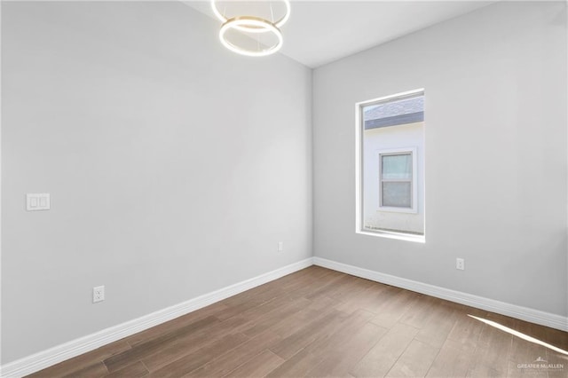 empty room with wood-type flooring