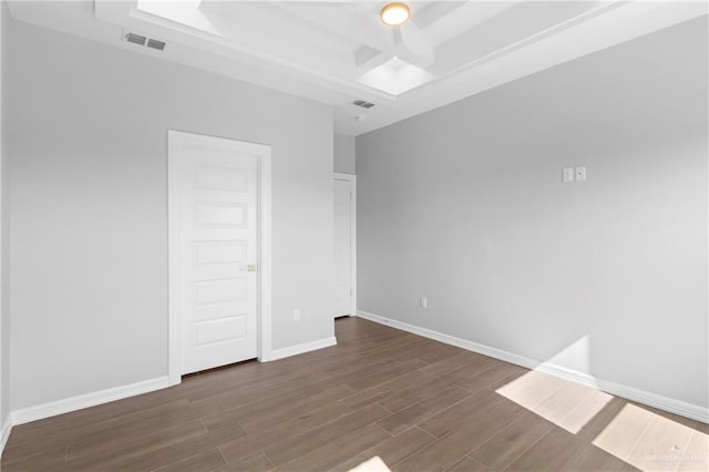 empty room featuring dark hardwood / wood-style flooring