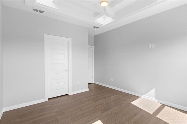 spare room featuring dark hardwood / wood-style floors