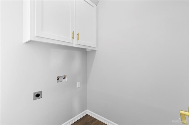 clothes washing area with cabinets, washer hookup, hardwood / wood-style flooring, and electric dryer hookup