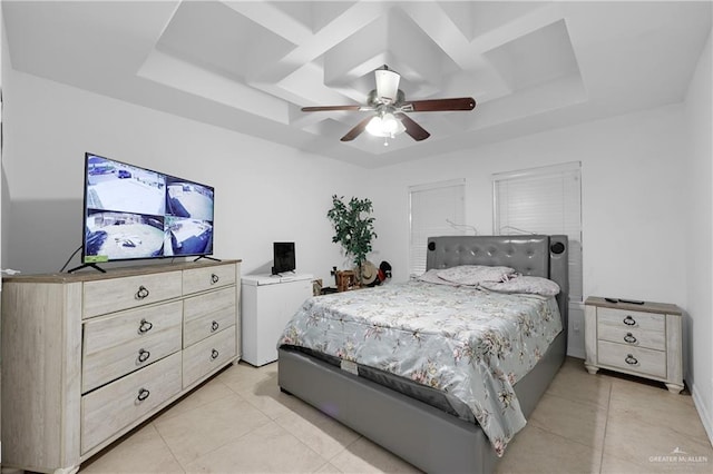 tiled bedroom featuring coffered ceiling, ceiling fan, and a tray ceiling