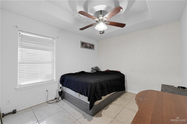 bedroom with ceiling fan and light tile patterned flooring