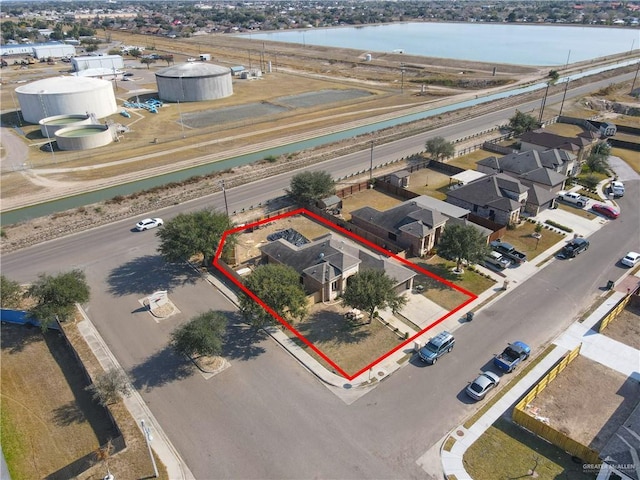 birds eye view of property featuring a water view