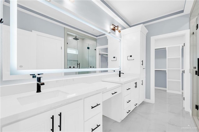 bathroom featuring a sink, marble finish floor, a spacious closet, double vanity, and a stall shower