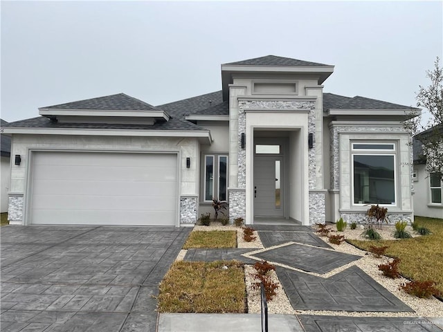 prairie-style home featuring a garage