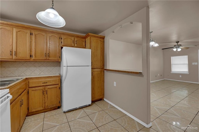 kitchen featuring pendant lighting, white appliances, backsplash, ceiling fan, and light tile patterned floors