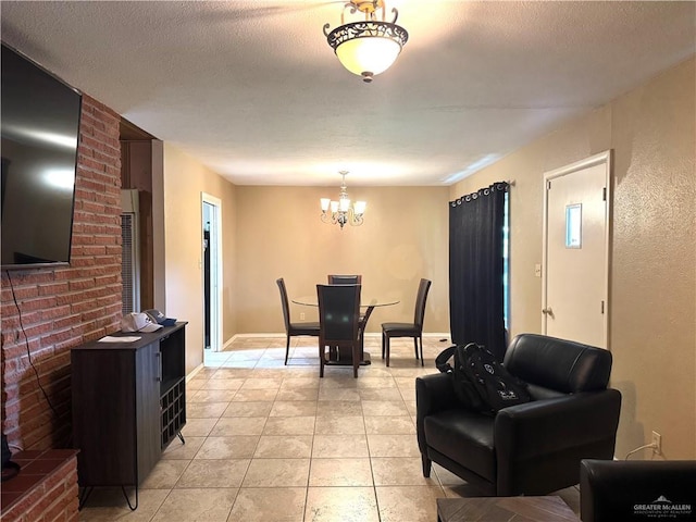 907 W 7th St, Weslaco, TX 78596 - dining space featuring a chandelier, light tile patterned floors, and a textured ceiling