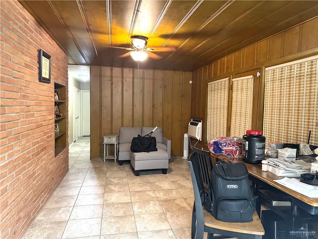 907 W 7th St, Weslaco, TX 78596 - home office featuring brick wall, a ceiling fan, wooden walls, and light tile patterned floors
