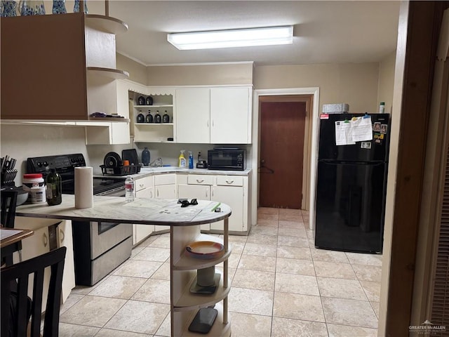 907 W 7th St, Weslaco, TX 78596 - kitchen with black appliances, open shelves, light countertops, white cabinetry, and light tile patterned floors