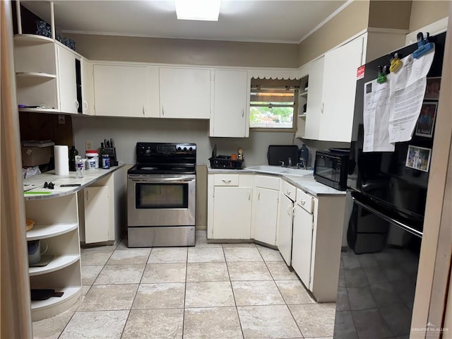 907 W 7th St, Weslaco, TX 78596 - kitchen with open shelves, black appliances, ornamental molding, light countertops, and white cabinetry