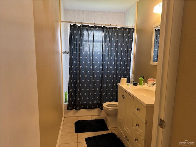 907 W 7th St, Weslaco, TX 78596 - bathroom with tile patterned flooring, vanity, and shower / tub combo with curtain